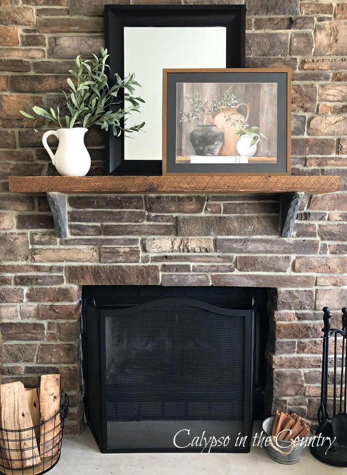 earth toned decor on stone fireplace - neutral fall decor ideas for the home