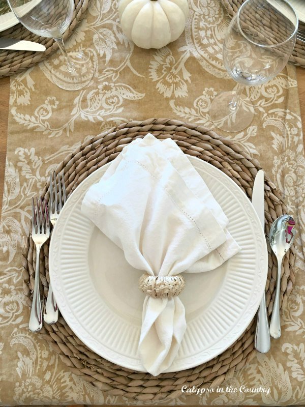 White plate and napkin table place setting for fall