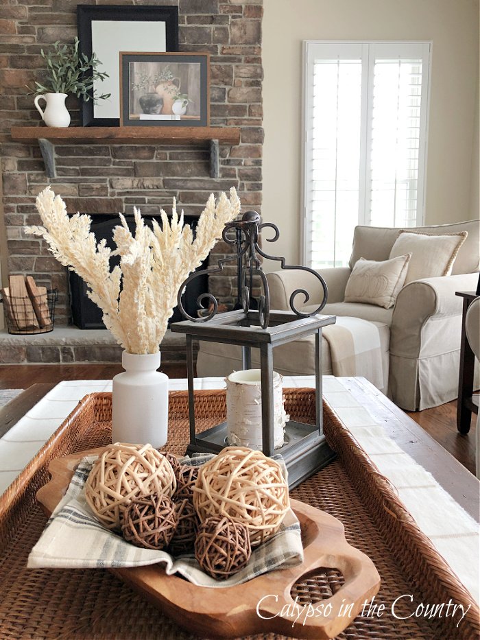 coffee table with basket and neutral fall decor