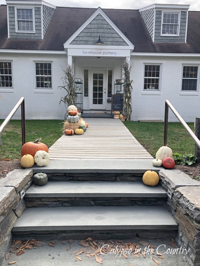 Farmhouse Pottery store entrance with pumpkins - October shopping