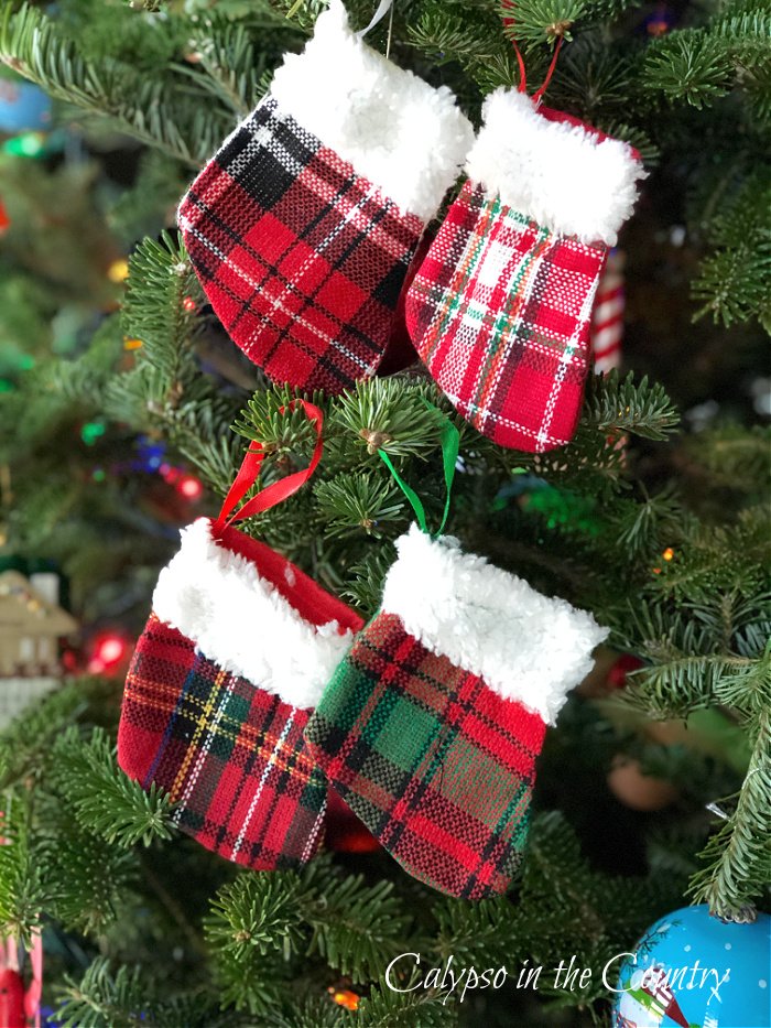 Mini stocking ornaments displayed on Christmas tree 