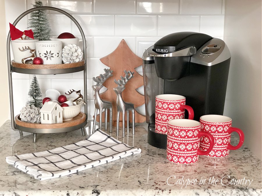 Red and white Christmas coffee station on kitchen countertop