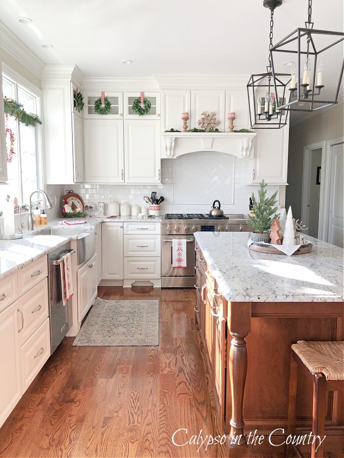 White kitchen with wood floors - 2022 Christmas home tour