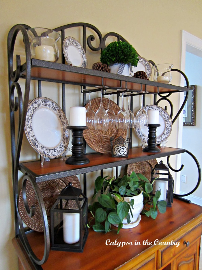 Wood and metal scrolled baker's rack with black and white dishes and accessories - January home decor