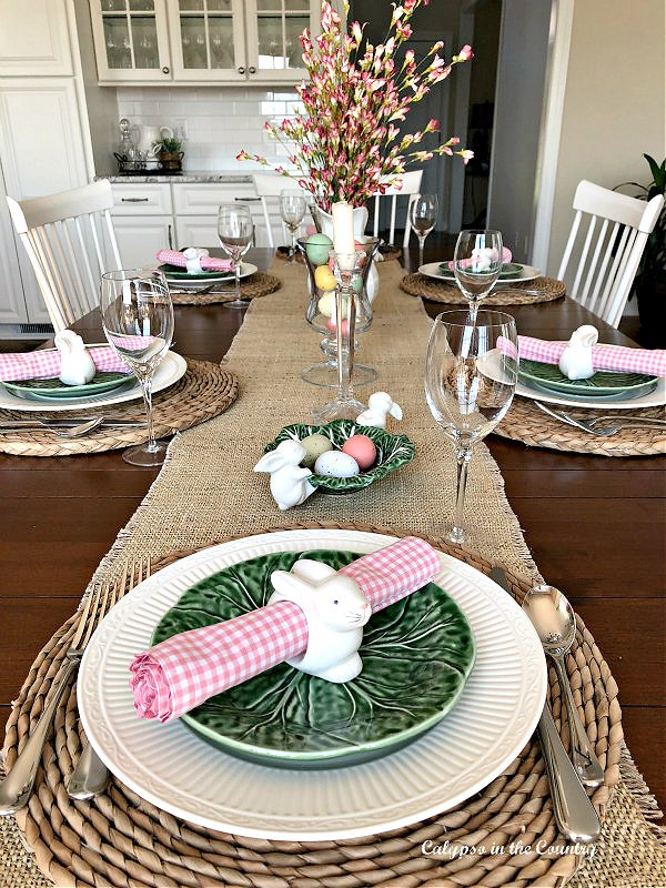 Spring tablescape wth Easter decorations and green cabbageware plates