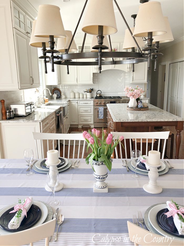 Blue and white spring tablescape in white kitchen
