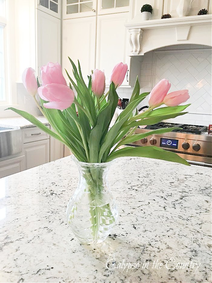 Pink tulips in crystal vase 