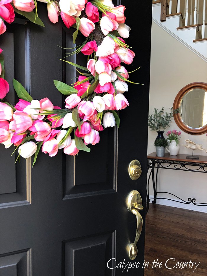 Pink tulip wreath on black front door - spring home tour 2023