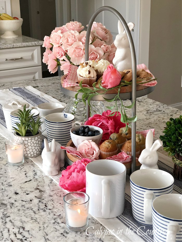 tiered tray decorated with pinks and bunnies - kitchen island decorating ideas