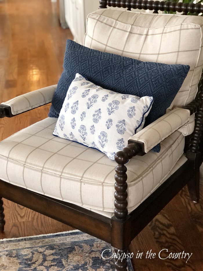 Blue and white block print pillow on spindle chair - block print home decor ideas