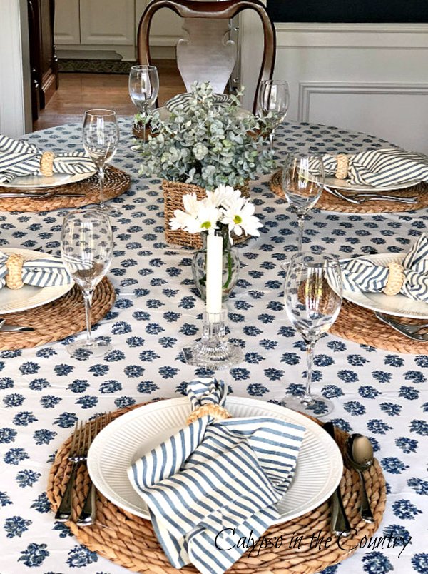 Blue and white tablescape with block print tablecloth and seagrass placemats - block print home decor