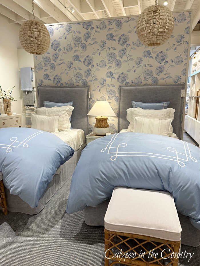 Blue and white coastal style bedroom with twin beds in Serena and Lily store - get ready for summer ideas