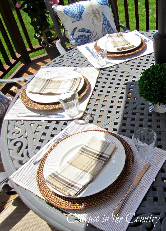 Patio table with neutral decorations for Father's Day - goodbye may hello June