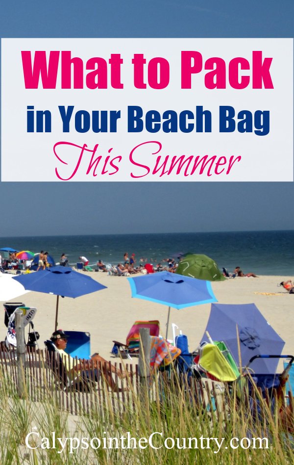 Beach with umbrellas - what to pack in your beach bag this summer