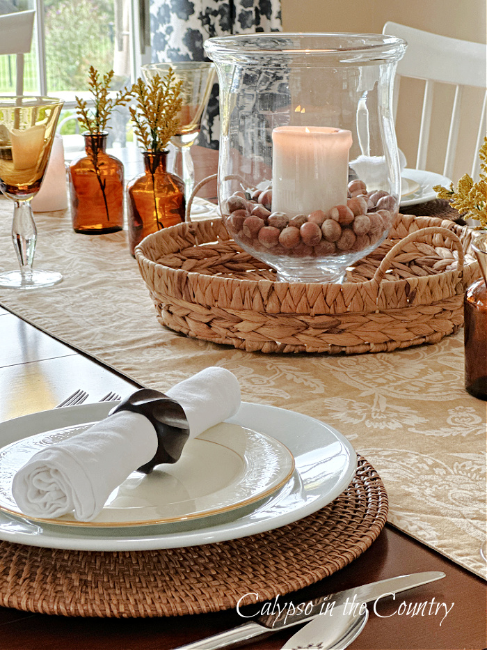 Neutral fall table with natural elements and white plates