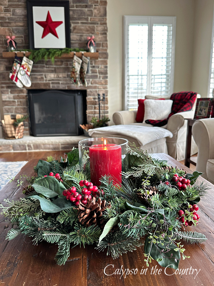 Wreath and red candle centerpiece on coffee table - Christmas decorating ideas