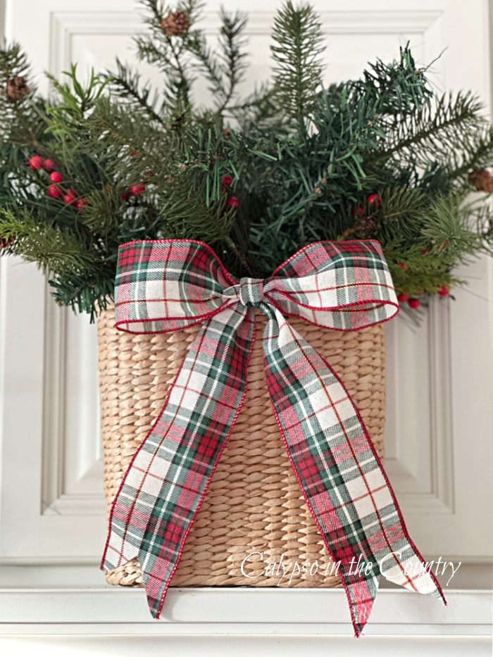 Basket of greenery with plaid bow