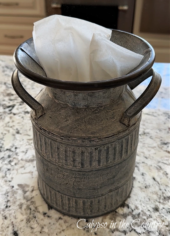 Galvanized milk can with tissues in top 