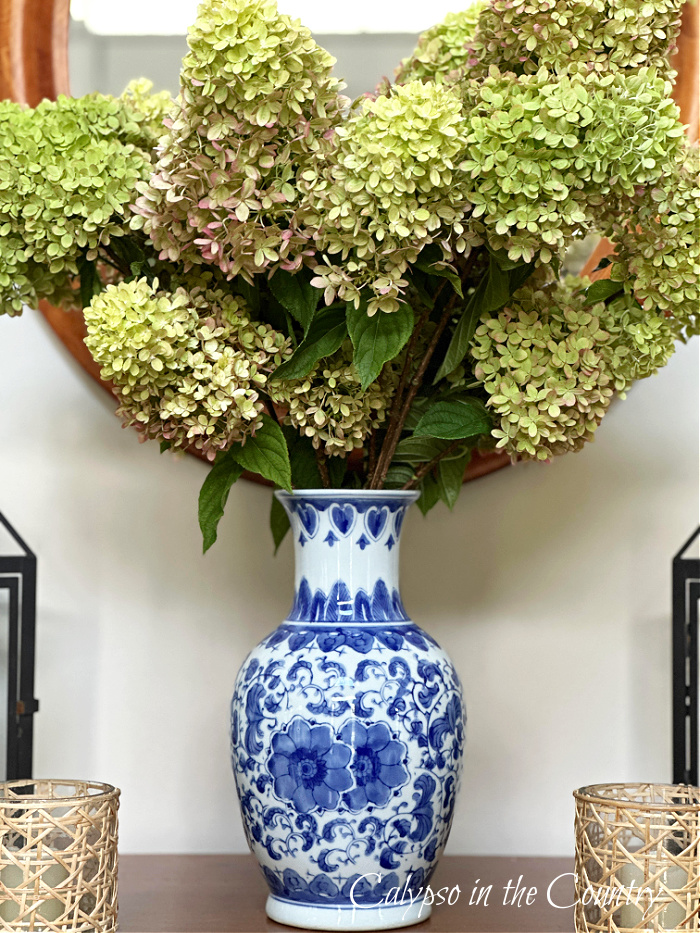 green hydrangeas in blue and white porcelain vase - blue and white fall decorating ideas