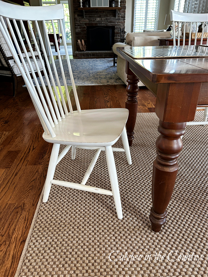White dining chair and outdoor seagrass rug - goodbye august hello september