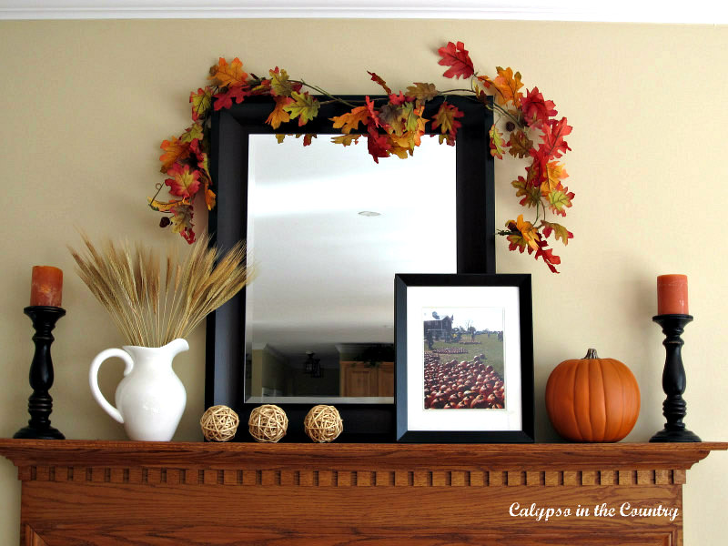 Fall mantel with black mirror and orange pumpkins - simple elegant fall decor