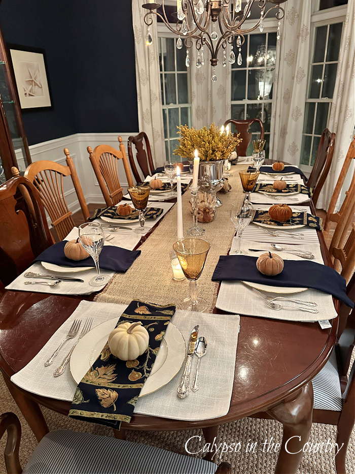 Thanksgiving table setting in navy blue dining room - hello holiday season