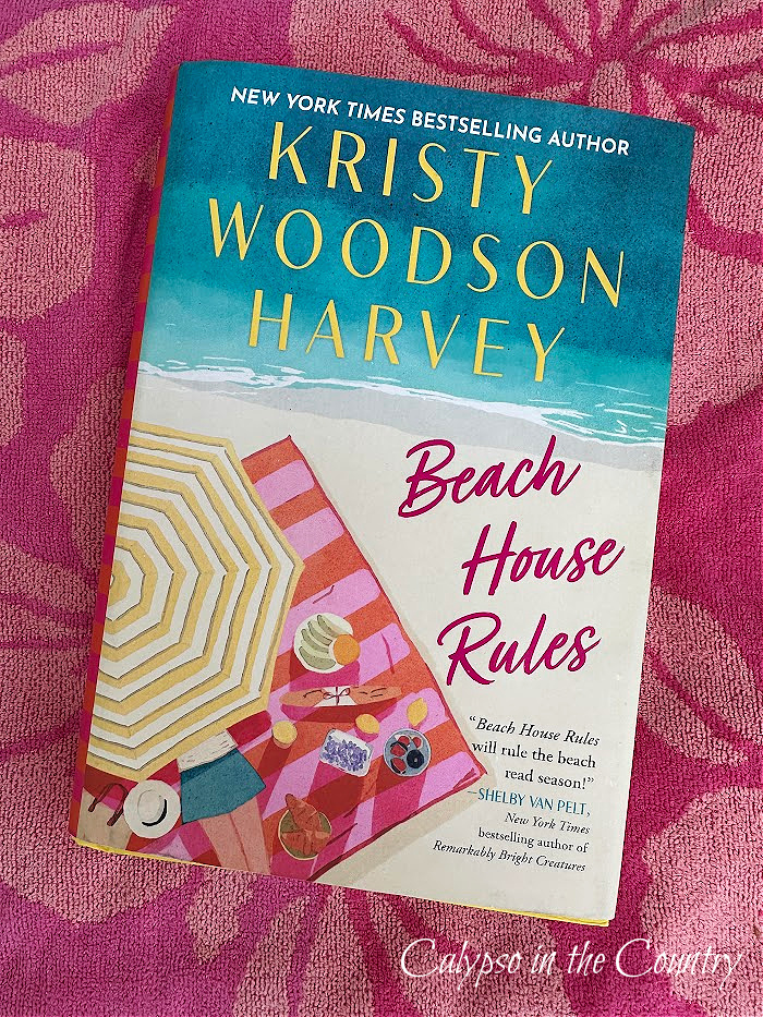 Kristy Woodson Harvey Beach House Rules book on pink floral beach towel