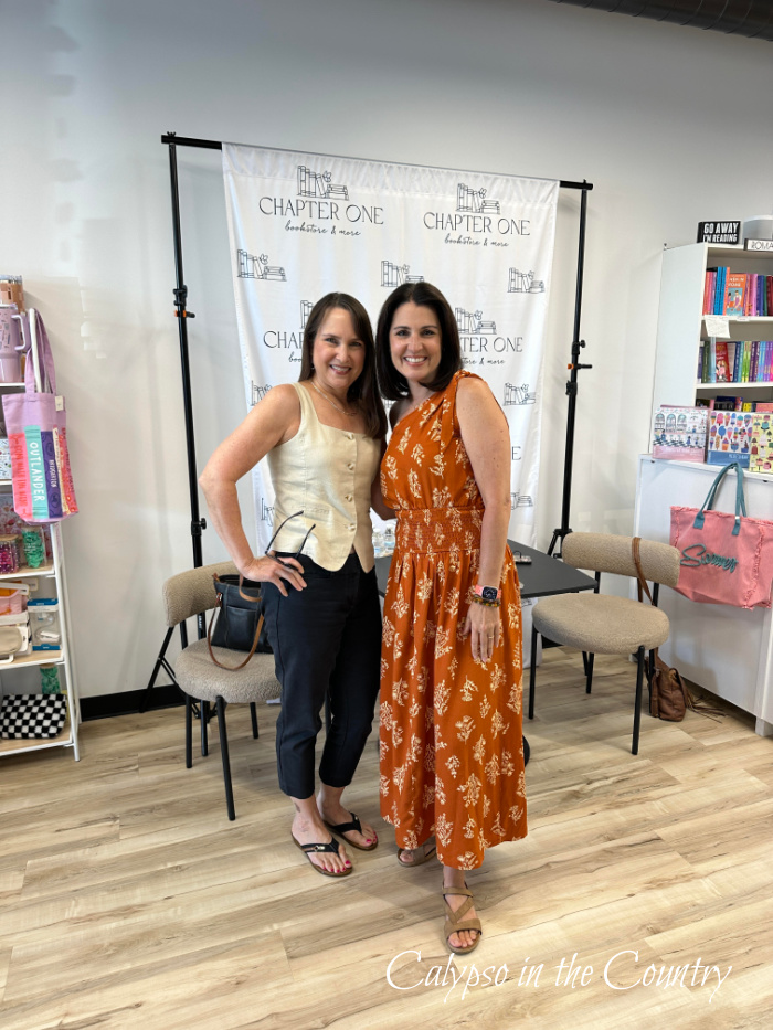 Two women posing in book store - June Recap