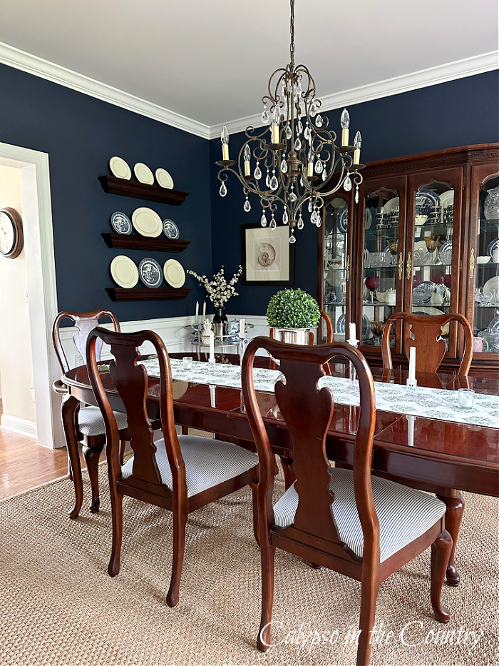 Navy blue dining room with traditional cherry furniture 