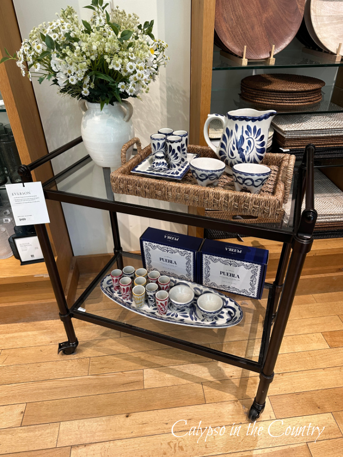Bar cart styled for summer with flowers and blue and white dishes - June recap