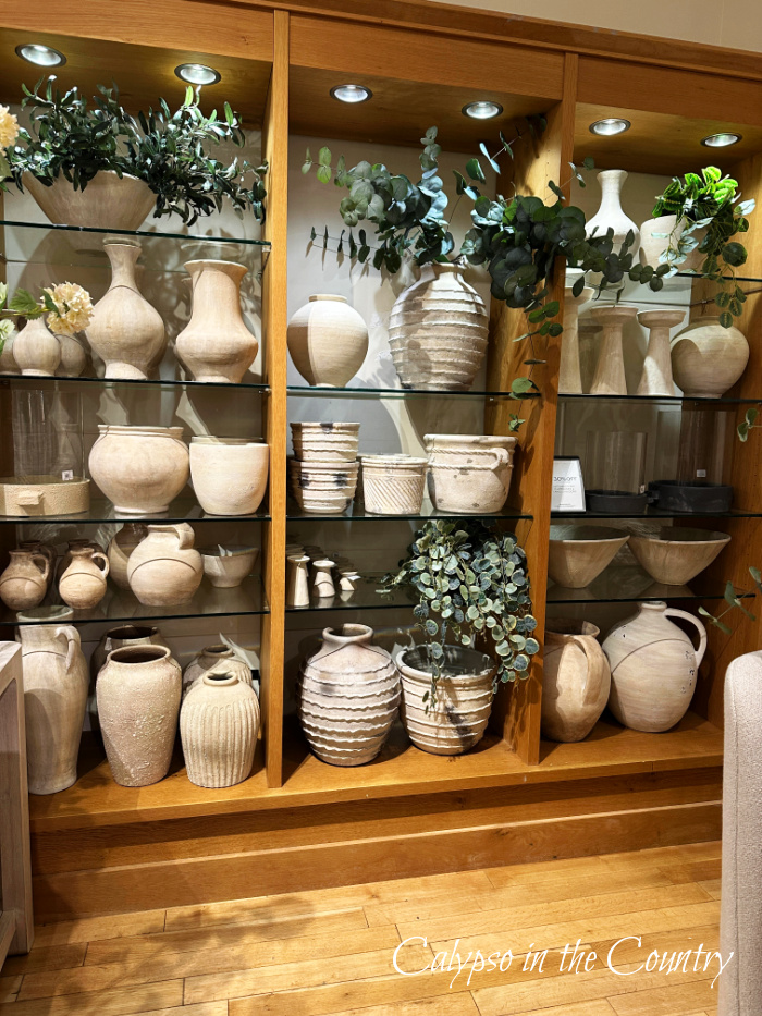 Store shelves filled with vases and greenery - June recap
