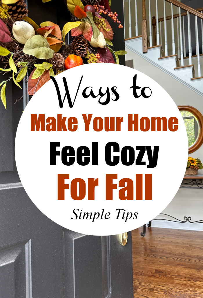 Black door with fall wreath - Ways to make your home feel cozy for fall