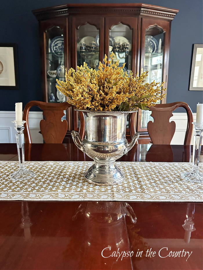Silver urn filled with golden stems on dining room table - October recap
