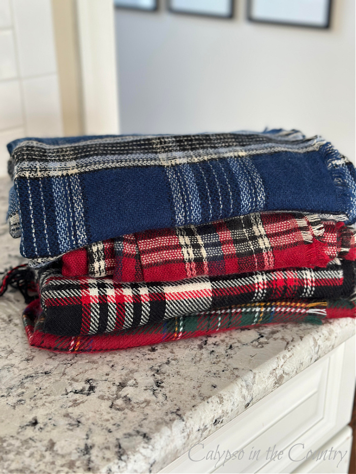 Stack of plaid blanket scarves - plaid Christmas tree ideas