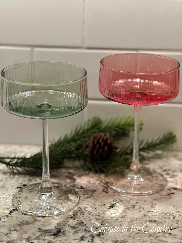 green and pink coupe glassware on countertop
