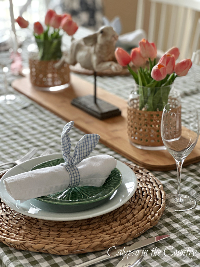 Pink tulips and bunny items on table setting