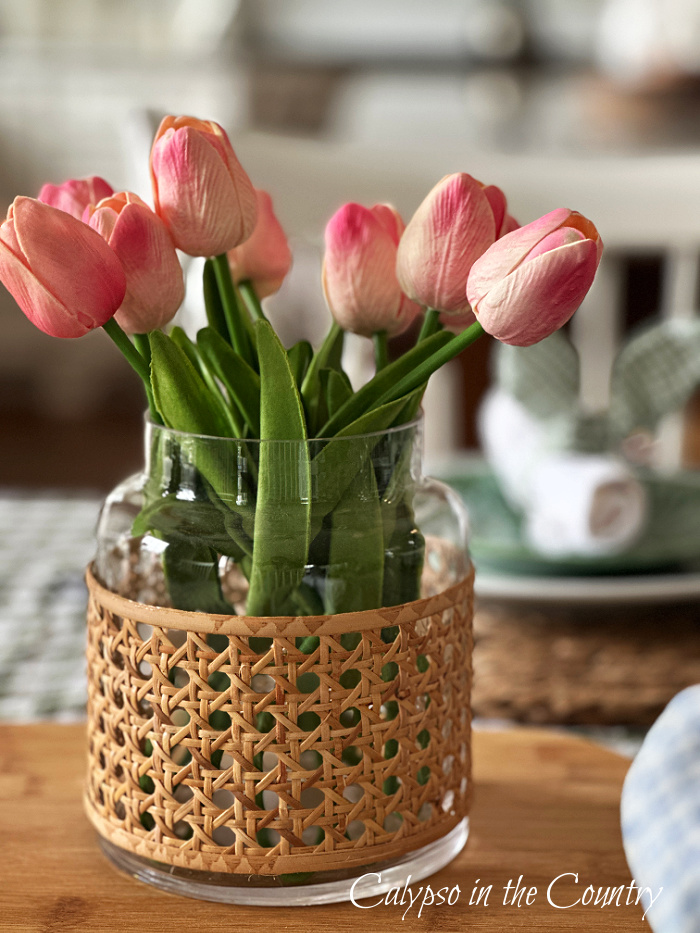 pink tulips in cane wrapped vase - Easter brunch table setting
