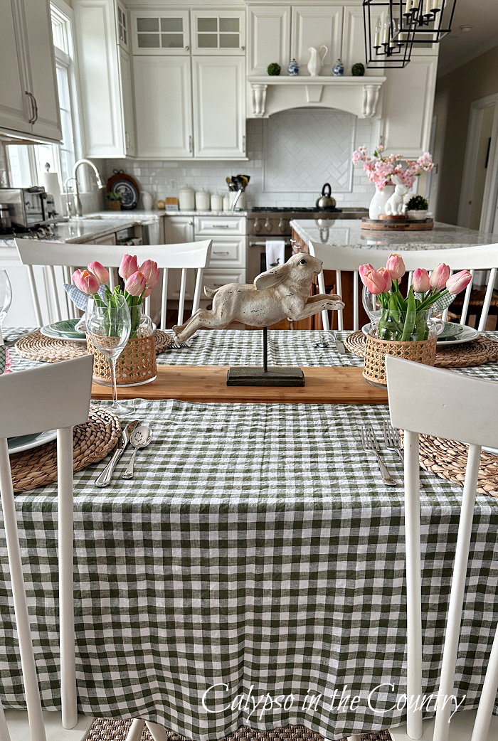 green checked table cloth with white chairs - Easter brunch table setting