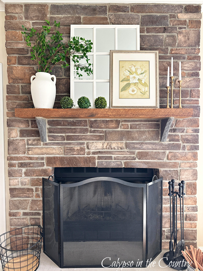Stone fireplace decorated for spring - Easter brunch table setting and home ideas