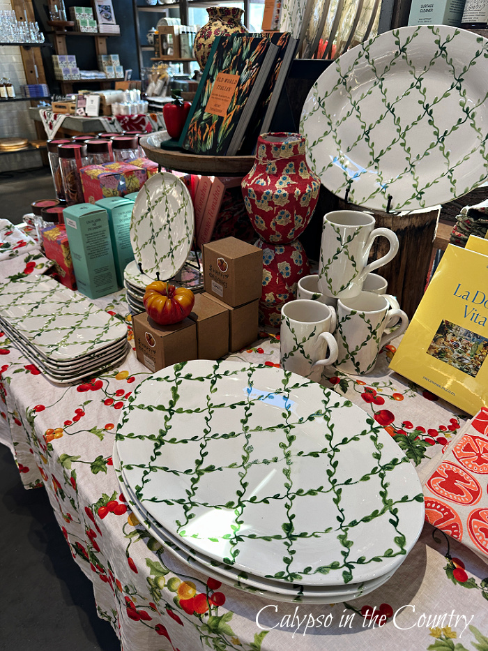 Green and white trellis dishes in store display - garden inspired home decor
