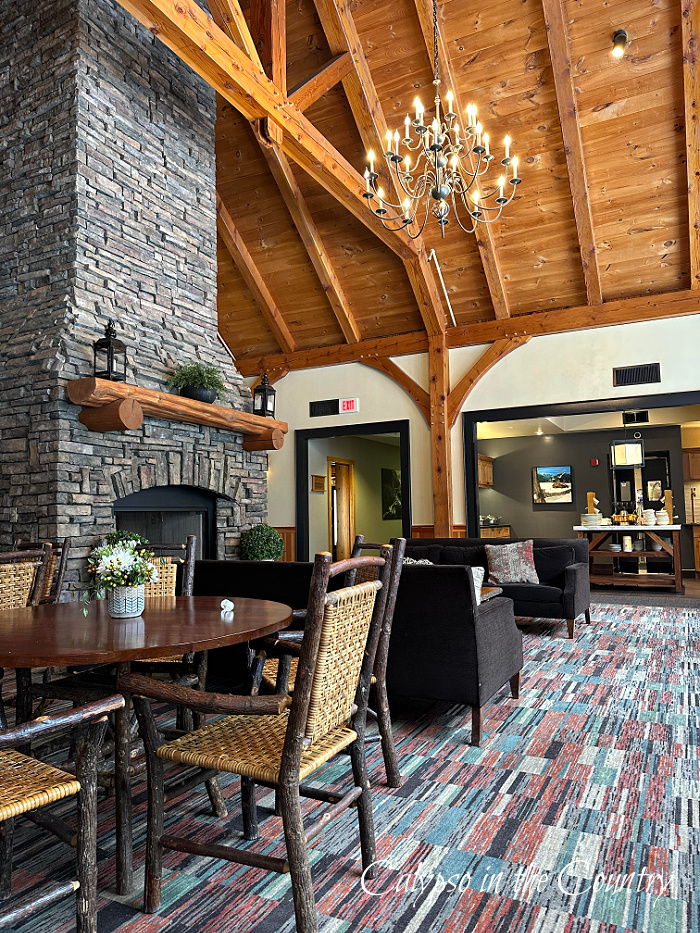 hotel lobby with stone fireplace and wood beamed ceiling - March recap