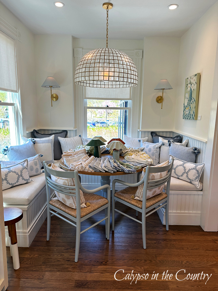 Dining nook with statement lighting over table in Serena and Lily store - April wrap up
