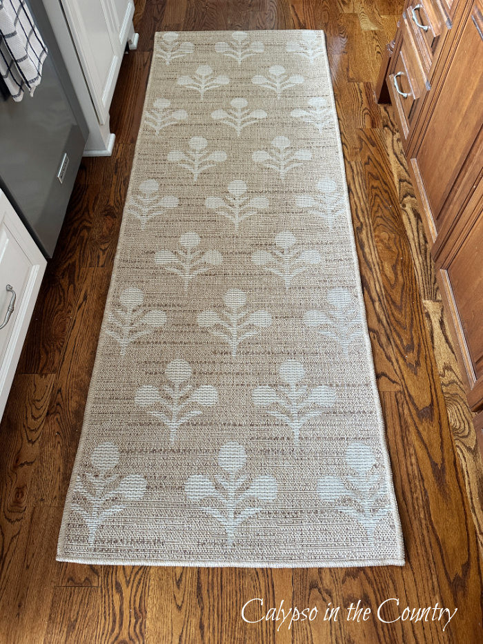 tan floral rug runner on wood floor in kitchen - Welcome May