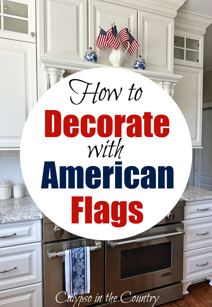White kitchen with pitcher of flags on stove mantel - How to Decorate with American Flags