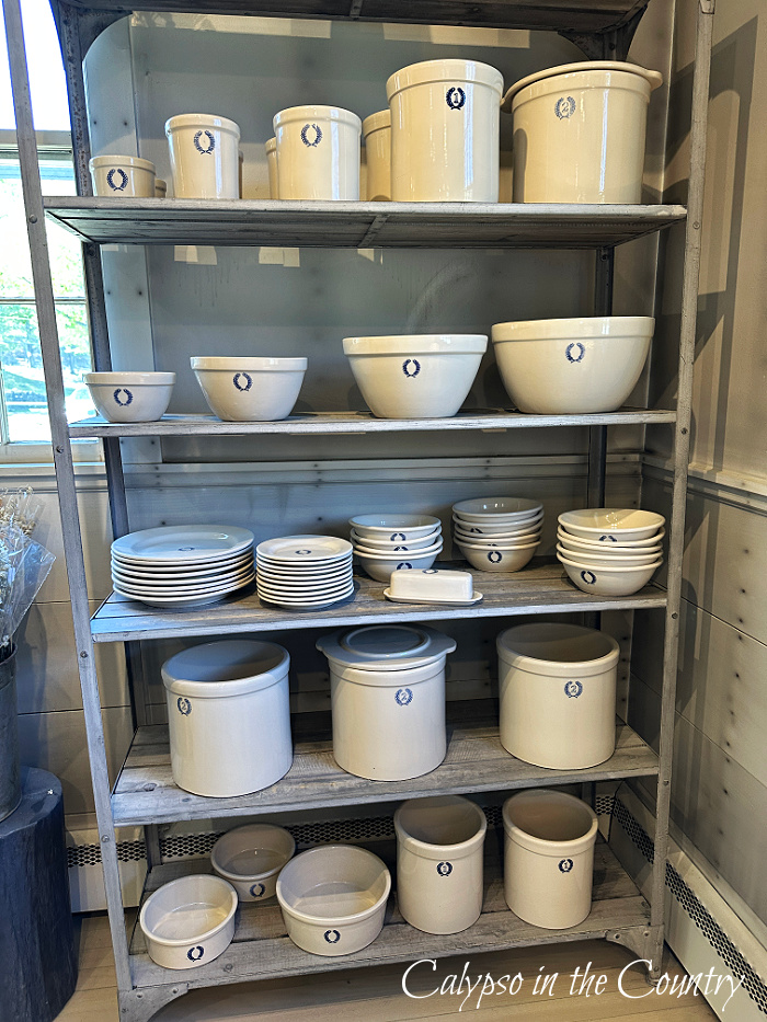 Store shelves with ceramic crocks - May wrap up