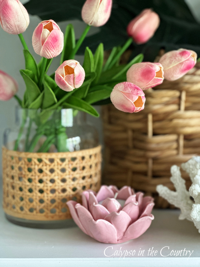 Pink tulips in cane vase with pink floral candle holder - May wrap up