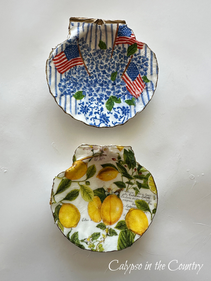 Two shells decorated with patterned napkins