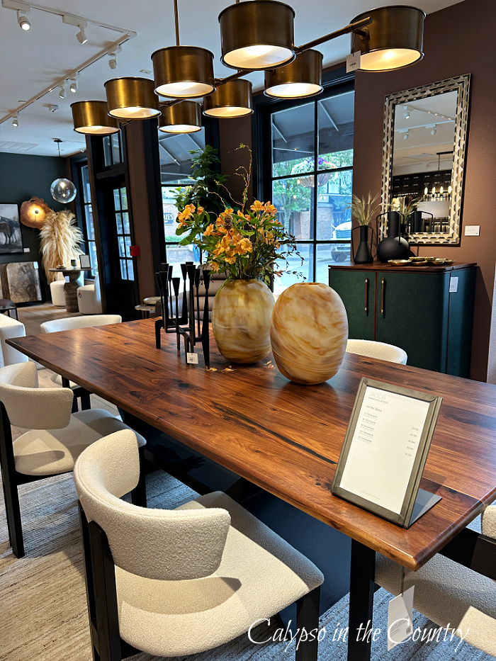 wood dining table with fabric chairs and modern light fixture - June wrap up