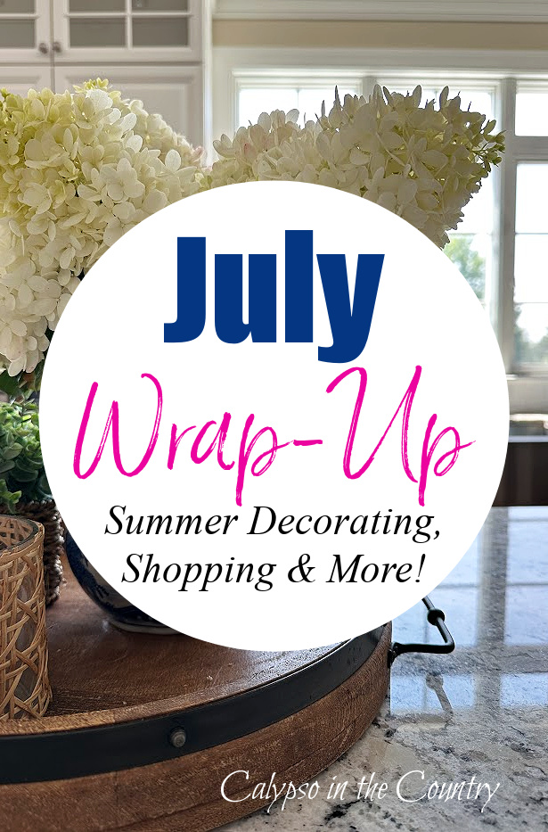 White hydrangeas in blue vase on wooden tray - July Wrap up
