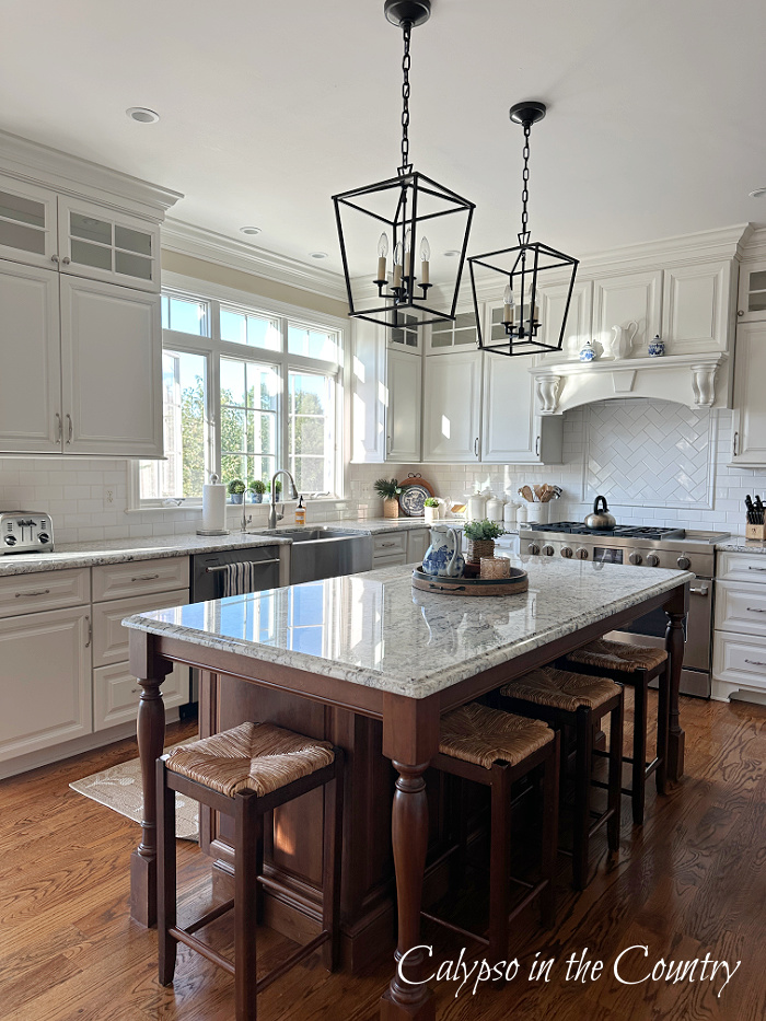 white kitchen with wood stained island - August wrap up